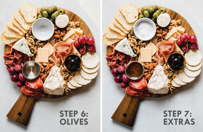 Adding honey, olives, and flakey salt to a cheese board. Grey text overlay reads \'step 6: olives, step 7: extras.\'
