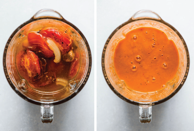 Roasted tomatoes, onions, and vegetable stock being puréed in a blender.