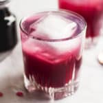 Blueberry spritzer in a cocktail glass.