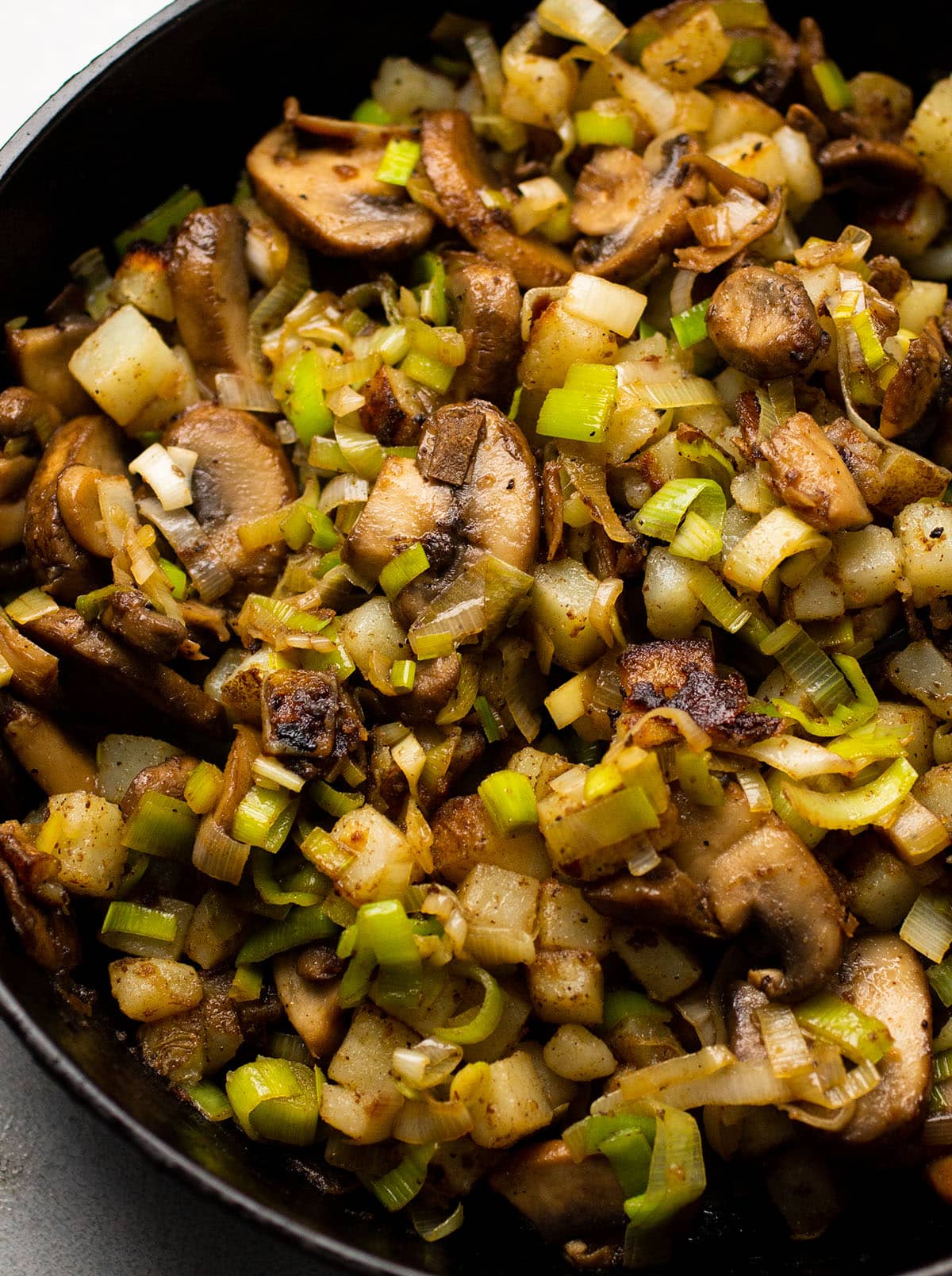 Mushroom leek hash in a cast iron skillet.