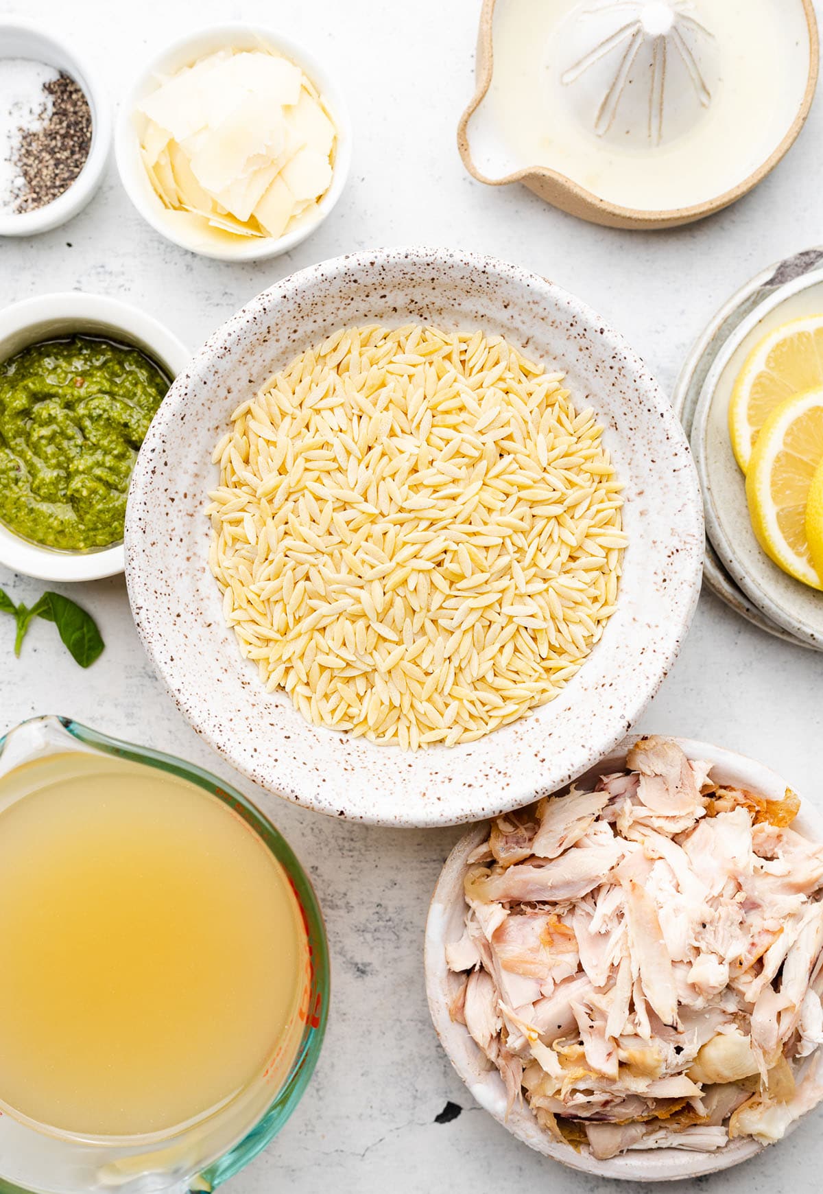 Chicken soup ingredients, measured out and placed into individual small bowls.