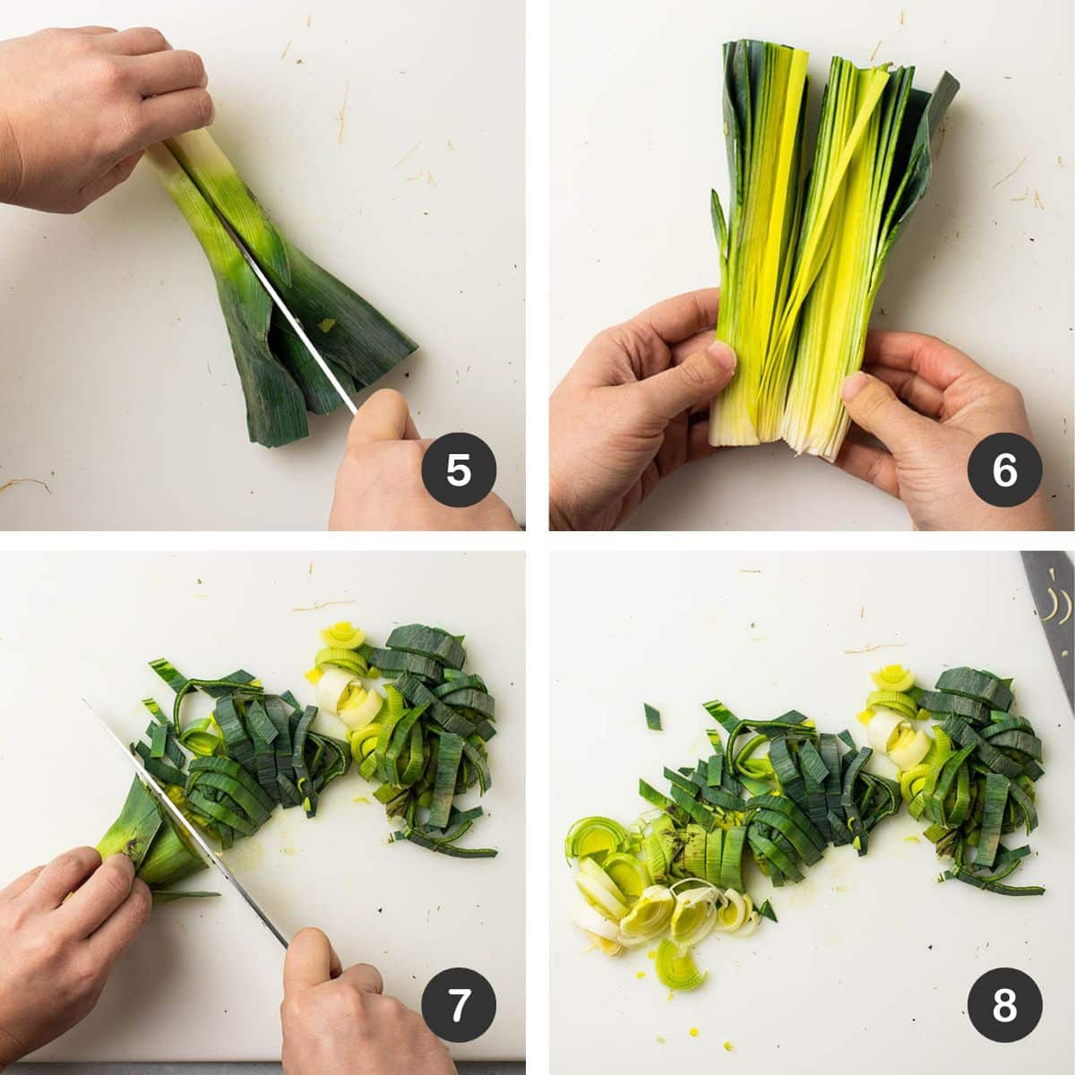 Slicing a leek on a white cutting board.