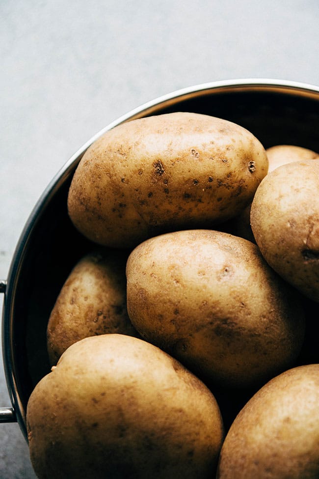 White potatoes in a large saucepot.